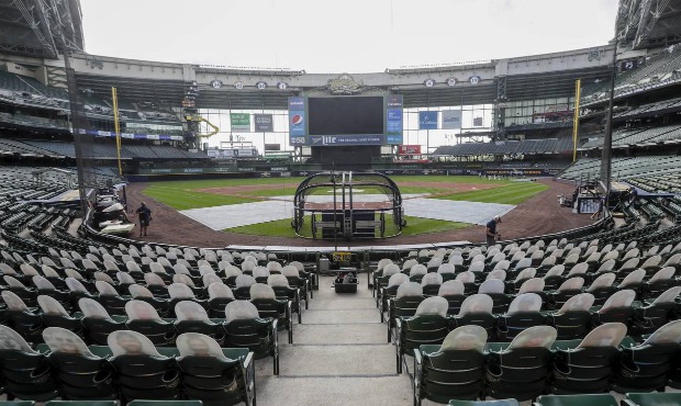 In this Friday, July 31, 2020, file photo, fan cutouts sit in seats behind home plate at Miller Par...