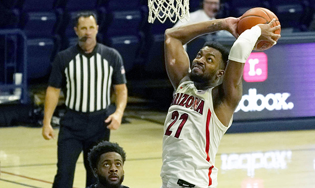 Arizona forward Jordan Brown (21) dunks against Grambling during the second half of an NCAA college...