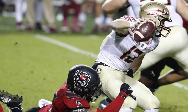 North Carolina State linebacker C.J. Hart Jr. (5) sacks Florida State quarterback Chubba Purdy (12)...