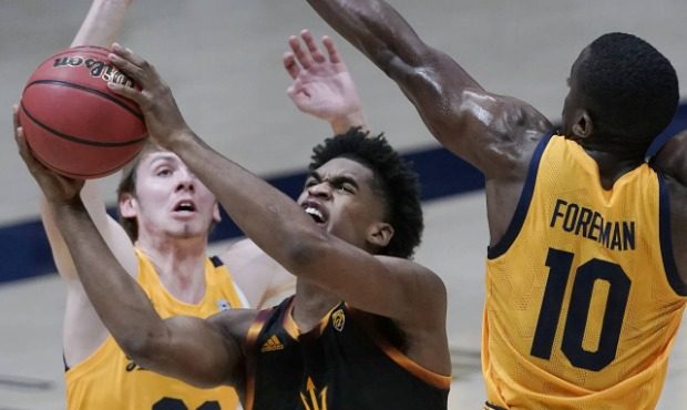 Arizona State guard Josh Christopher (13) shoots between California guards Ryan Betley (00) and Mak...