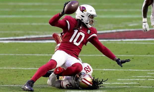 Arizona Cardinals wide receiver DeAndre Hopkins (10) is tackled by San Francisco 49ers cornerback J...