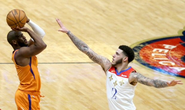 Chris Paul #3 of the Phoenix Suns shoots over Lonzo Ball #2 of the New Orleans Pelicans during the ...
