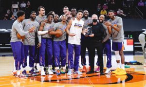 Devin Booker presented award by Sarver, calls Suns over for team picture