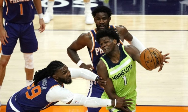 Minnesota Timberwolves forward Anthony Edwards (1) drives around Phoenix Suns forward Jae Crowder (...