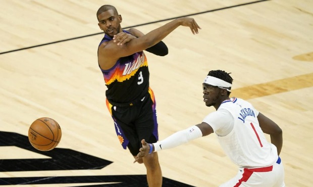 Phoenix Suns guard Chris Paul (3) passes as Los Angeles Clippers guard Reggie Jackson (1) defends d...