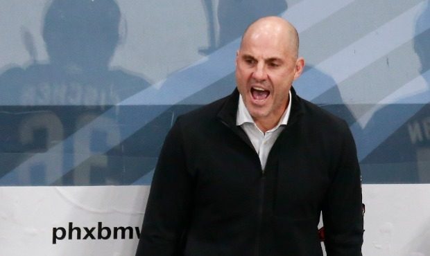Head coach Rick Tocchet of the Arizona Coyotes directs his players in the second period against the...