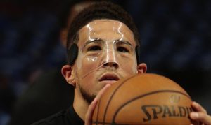 Suns' Devin Booker wears mask to protect broken nose in Game 3 of WCF