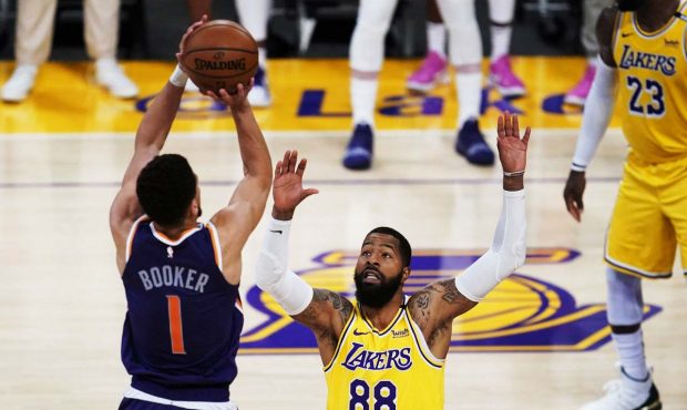 Phoenix Suns guard Devin Booker (1) shoots against Los Angeles Lakers forward Markieff Morris (88) ...