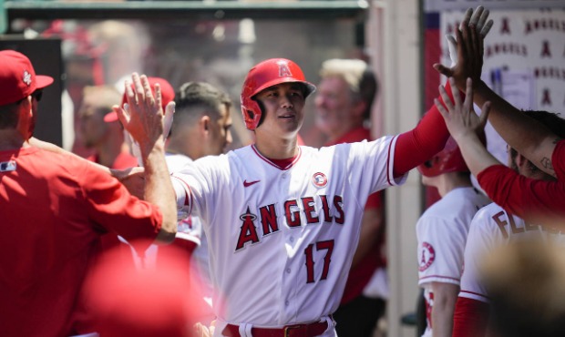 Los Angeles Angels designated hitter Shohei Ohtani (17) celebrates in the dugout with teammates aft...