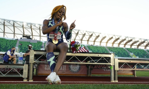 Sha'Carri Richardson celebrates after winning the women's 100-meter run at the U.S. Olympic Track a...