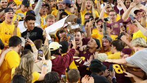 ASU CB Chase Lucas runs into student section with Territorial Cup