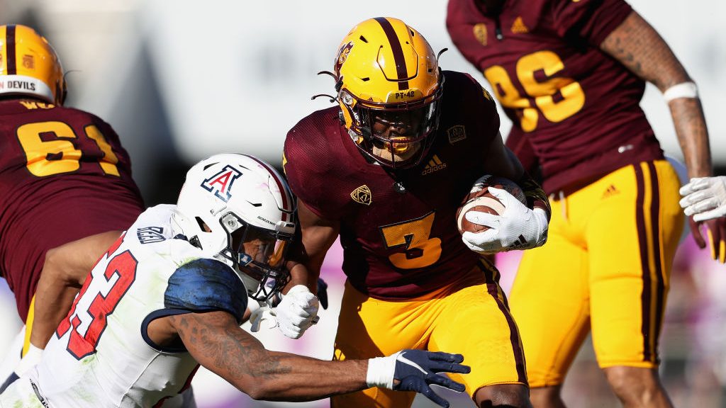 Running back Rachaad White #3 of the Arizona State Sun Devils rushes the football against linebacke...