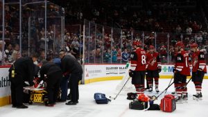 Coyotes' Clayton Keller leaves ice on stretcher after fall into boards