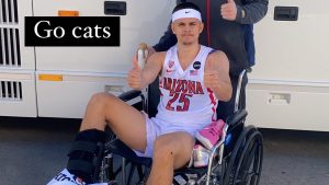 Kerr Kriisa exits Arizona Wildcats' locker room in wheelchair after injury