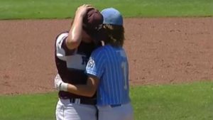 Little leaguer comforts pitcher after getting hit in the head