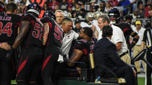 Cardinals' Rashard Lawrence carted off field vs. Saints, return questionable