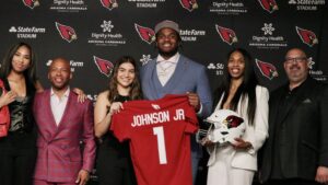 Got it from his mama: Cardinals OL Paris Johnson's charitable work a family affair