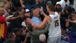 Nuggets' Nikola Jokic pushes Suns owner Mat Ishbia during Game 4