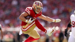 49ers' Christian McCaffrey hurdles, runs through Cardinals in Arizona loss
