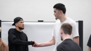 Phoenix Suns' Devin Booker gifts pair of Final Four teams Nike Book 1s