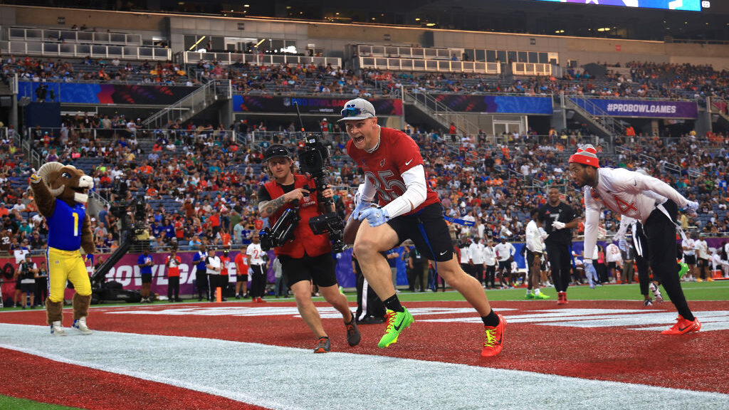 Arizona Cardinals' Budda Baker and Trey McBride both scored touchdowns during the flag football por...