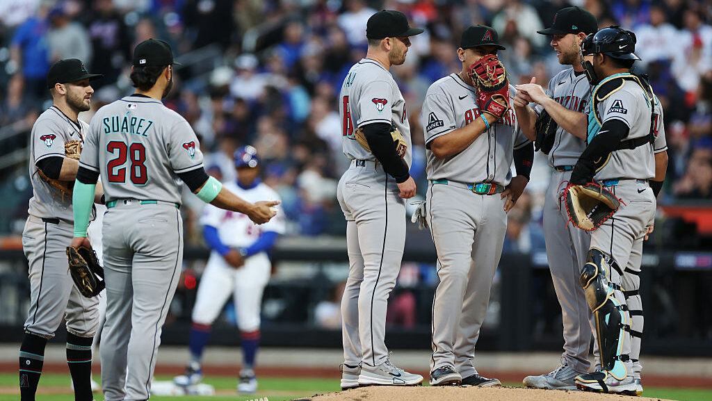 Arizona Diamondbacks meet on the mound with Corbin Burnes...