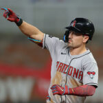 Corbin Carroll #7 of the Arizona Diamondbacks reacts as he rounds second base after hitting a three-run homer in the ninth inning against the Atlanta Braves at Truist Park on June 03, 2025 in Atlanta, Georgia. (Photo by Kevin C. Cox/Getty Images)