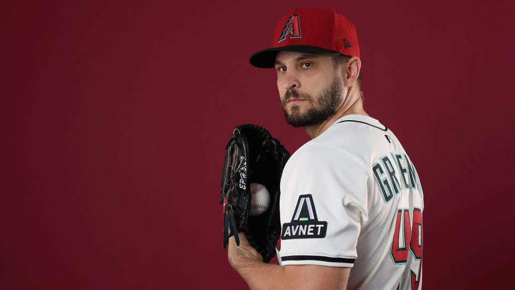 Diamondbacks reliever Kendall Graveman looks on...