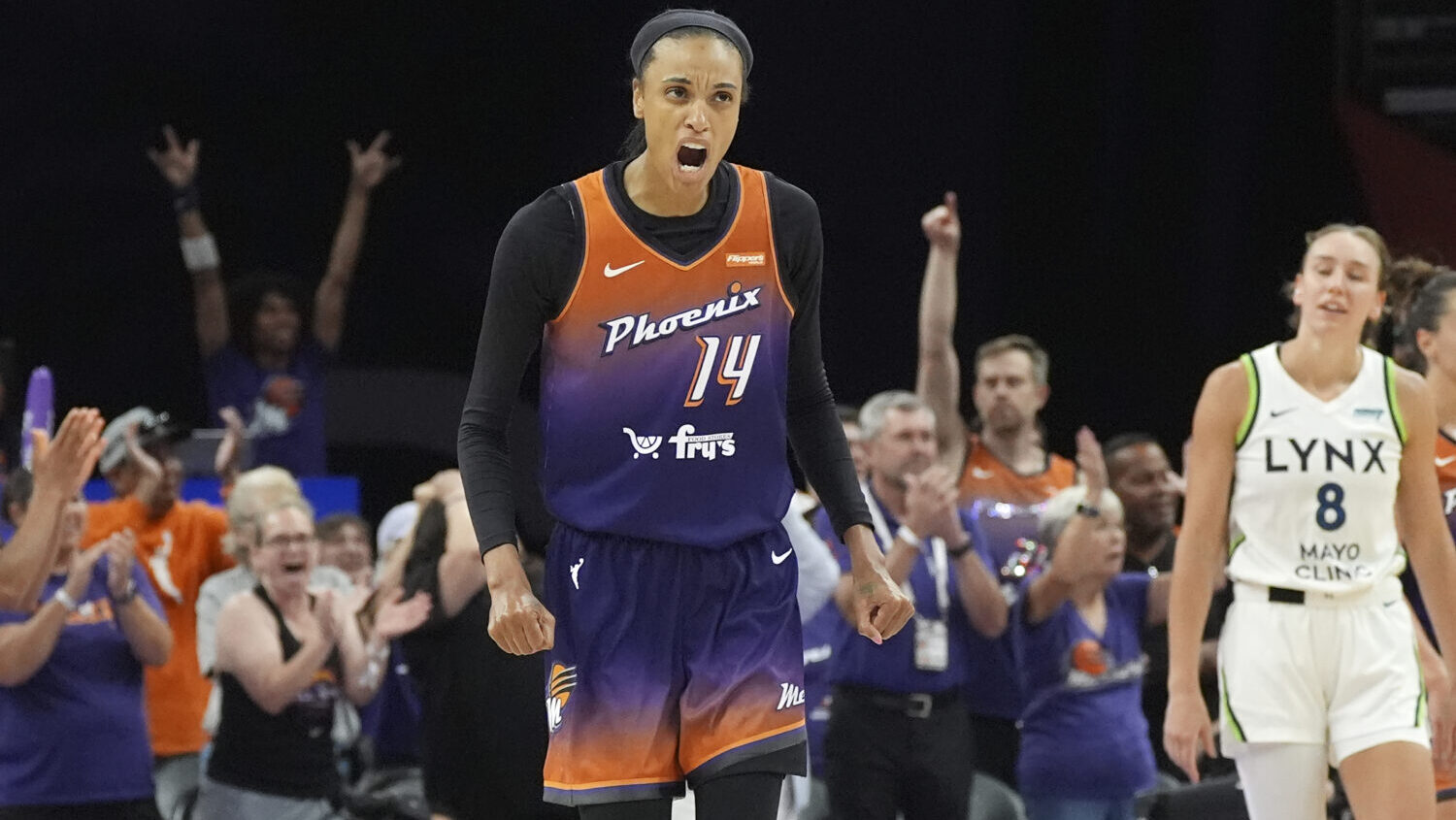 Phoenix Mercury forward DeWanna Bonner celebrates a Mercury score as Minnesota Lynx forward Alanna ...