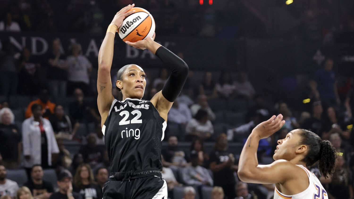 Las Vegas Aces center A'ja Wilson (22) looks to shoot over Phoenix Mercury forward Alyssa Thomas (2...