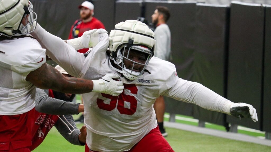 Cardinals Elijah Simmons runs through drills during training camp...
