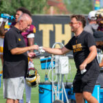 ASU football staff members with cowbells at practice on Sept. 2, 2025, as the Sun Devils prepare for a game at Mississippi State. (Damon Allred/Arizona Sports)