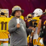 ASU football staff member with cowbells at practice on Sept. 2, 2025, as the Sun Devils prepare for a game at Mississippi State. (Damon Allred/Arizona Sports)
