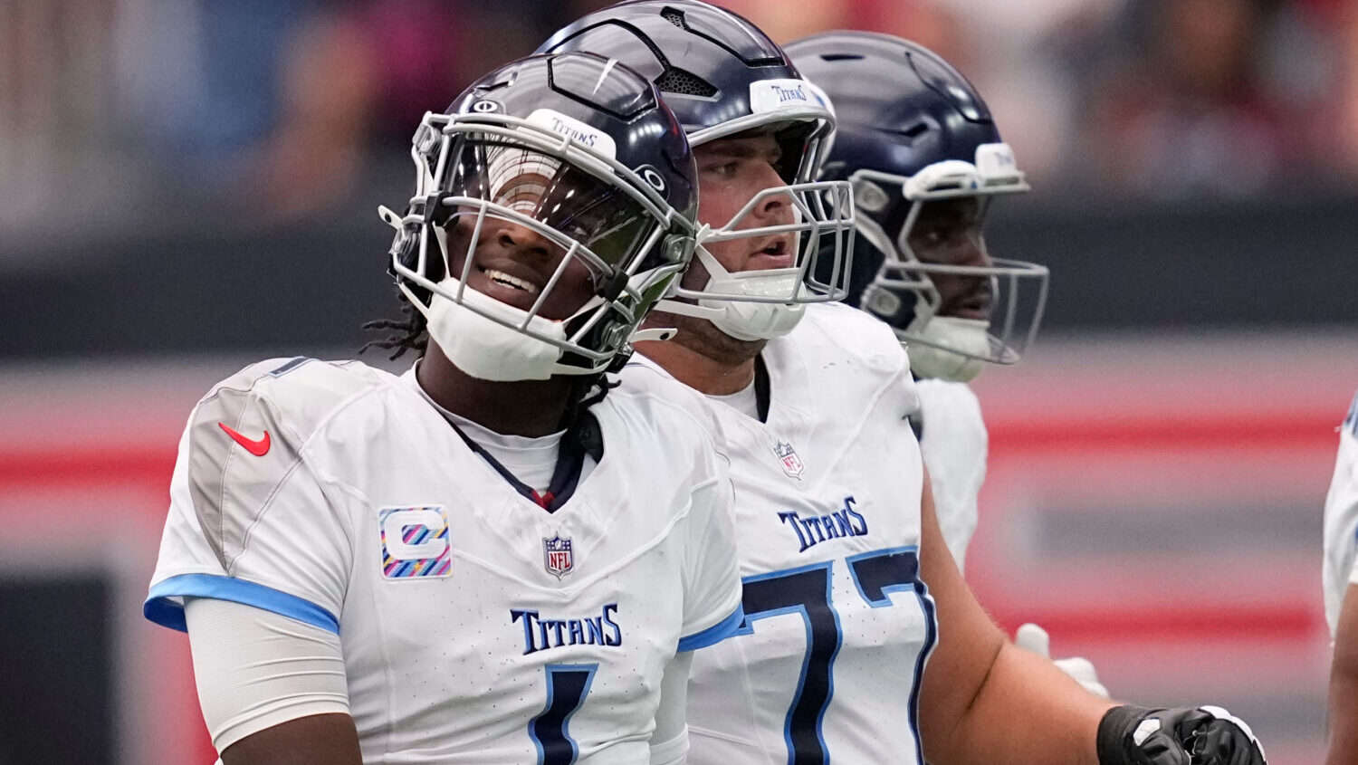 Tennessee Titans quarterback Cam Ward (1) reacts as he walks to the sideline after throwing an inte...