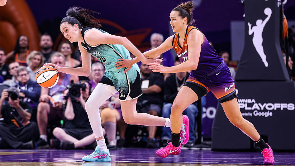 Breanna Stewart #30 of the New York Liberty dribbles the ball while Kathryn Westbeld #24 of the Pho...
