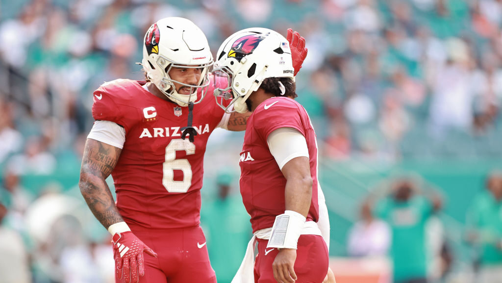 Cardinals' James Conner and Kyler Murray celebrate...