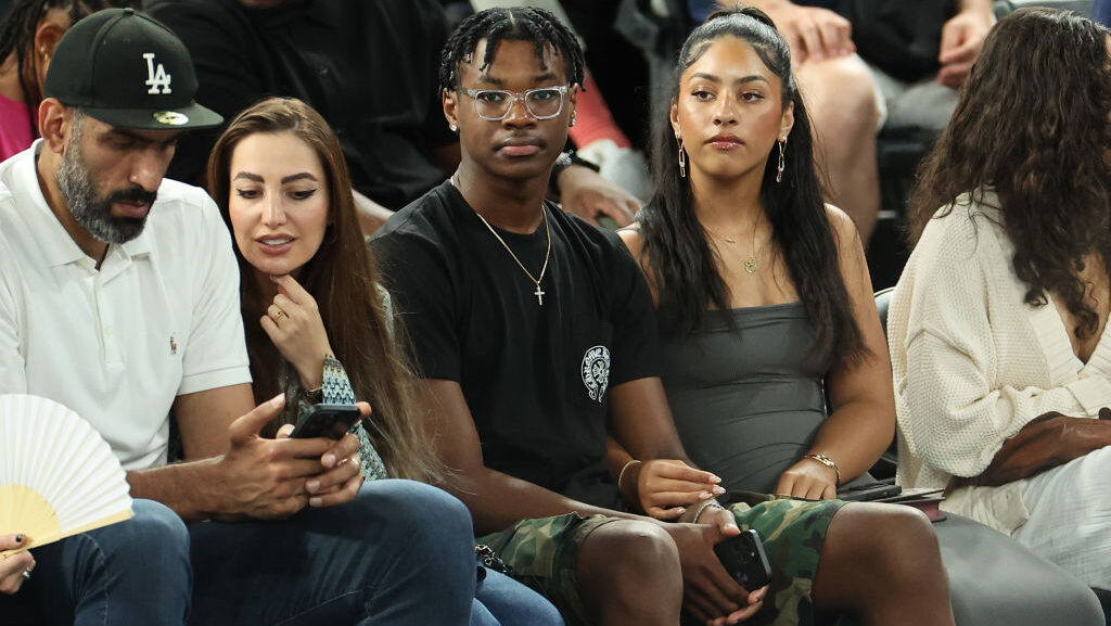 Bryce James (C), son of LeBron James #6 of Team United States, looks on during a Men's basketball s...