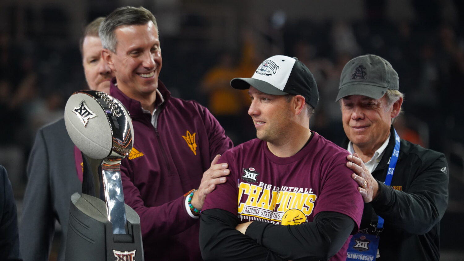 From left to right, Arizona State AD Graham Rossini, coach Kenny Dillingham and president Michael C...