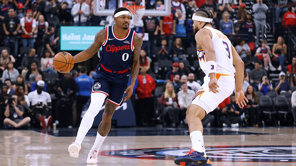 Bradley Beal #0 of the LA Clippers dribbles in front of Dillon Brooks #3 of the Phoenix Suns...