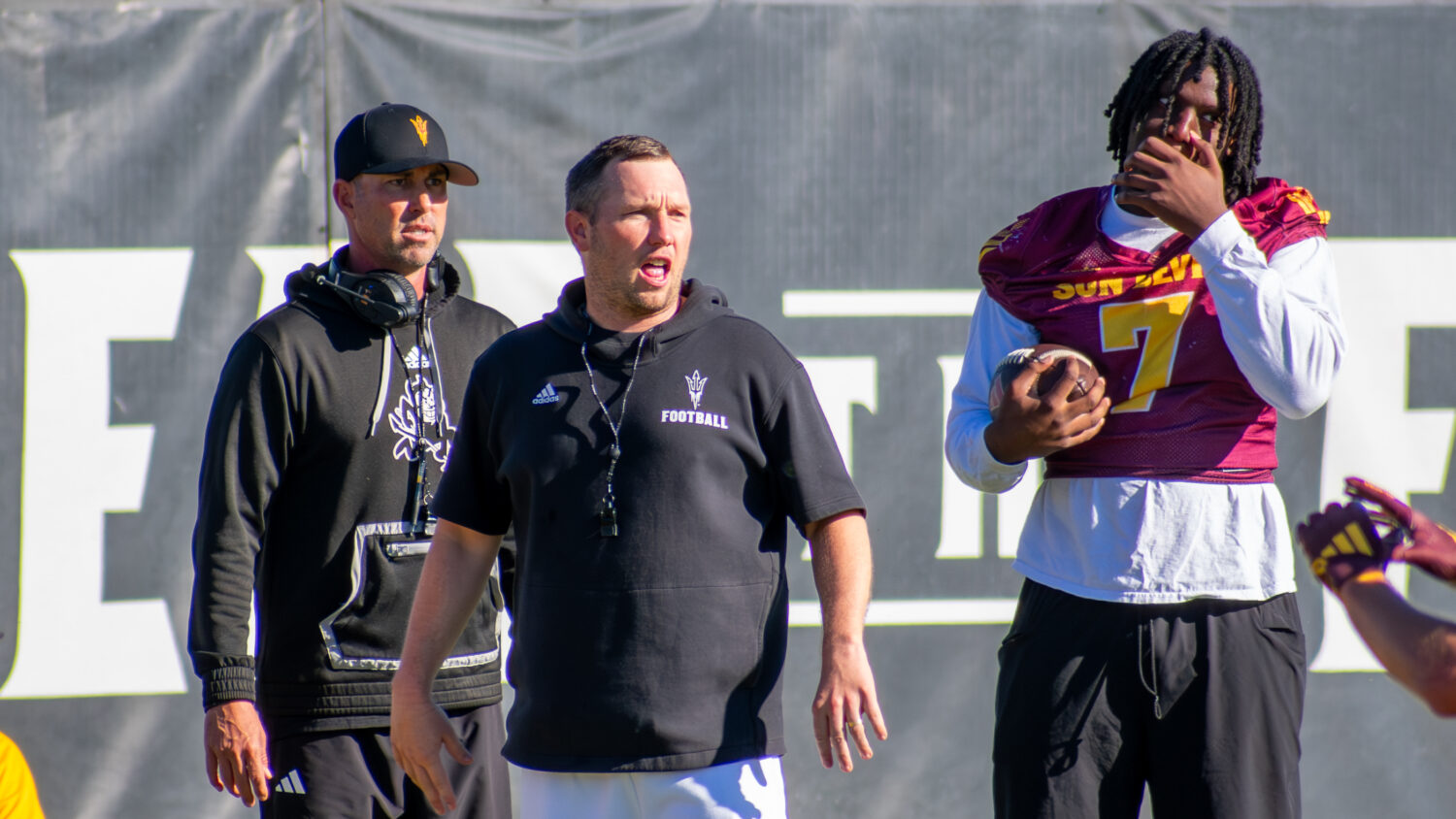 Arizona State football head coach Kenny Dillingham (center), tight ends coach Jason Mohns (left) an...