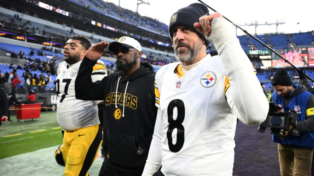 Pittsburgh Steelers head coach Mike Tomlin and quarterback Aaron Rodgers (8) leave the field after an NFL football game against the Baltimore Ravens, Sunday, Dec. 7, 2025, in Baltimore. (AP Photo/Nick Wass)Credit: ASSOCIATED PRESS