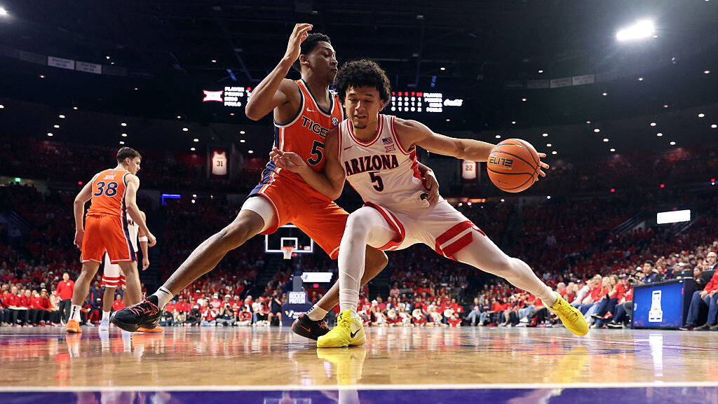 Brayden Burries #5 of the Arizona Wildcats posts up on Kaden Magwood #5 of the Auburn Tigers during...