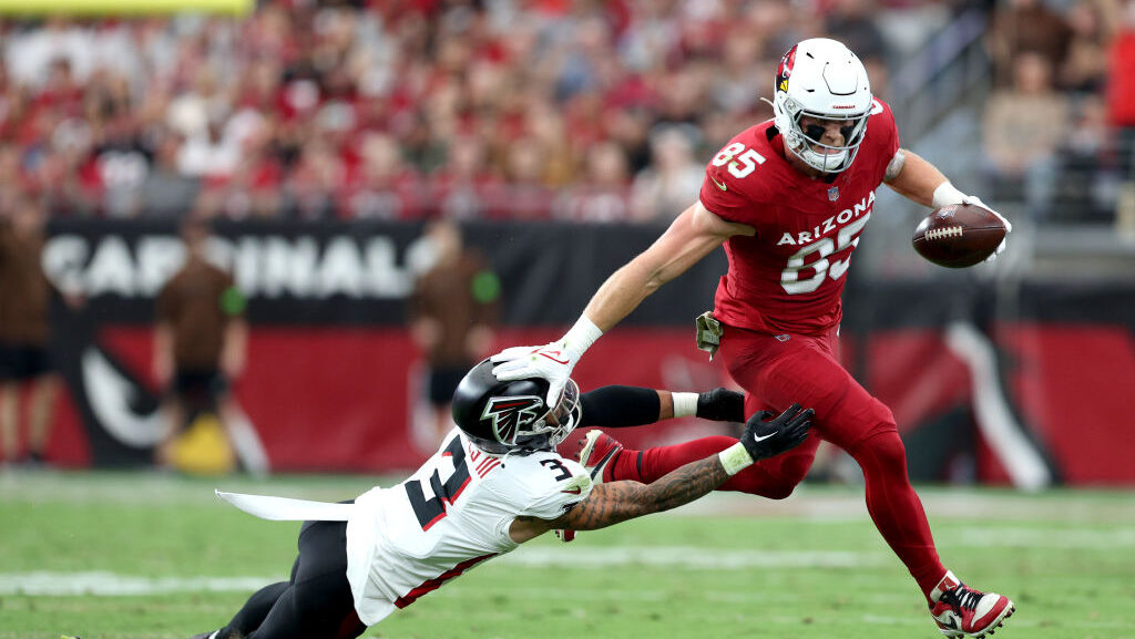 Trey McBride #85 of the Arizona Cardinals runs the ball against Jessie Bates III #3 of the Atlanta ...