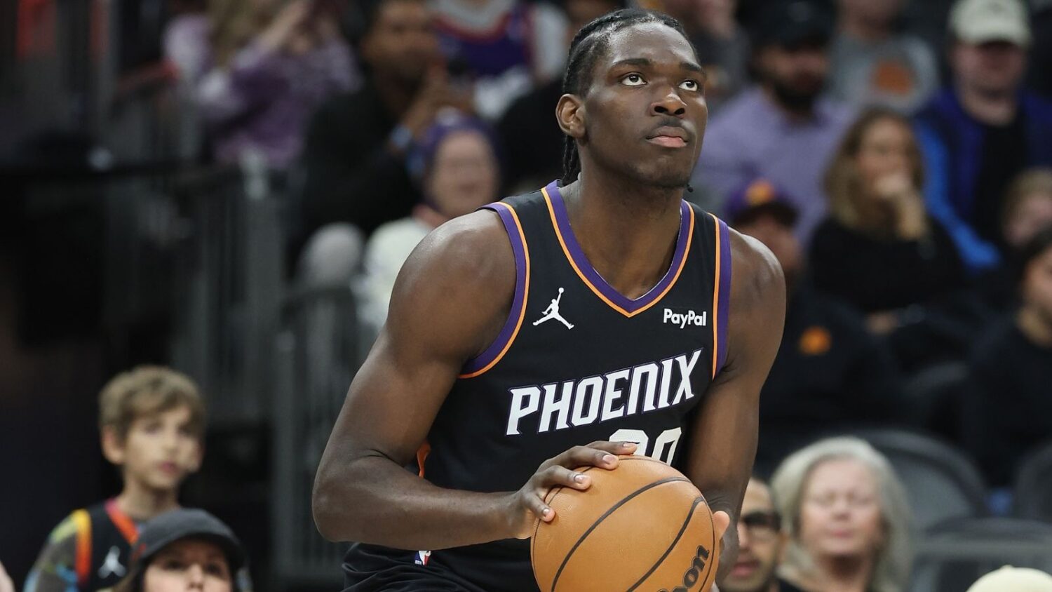 PHOENIX, ARIZONA - JANUARY 11: Rasheer Fleming #20 of the Phoenix Suns looks to shoot during the se...