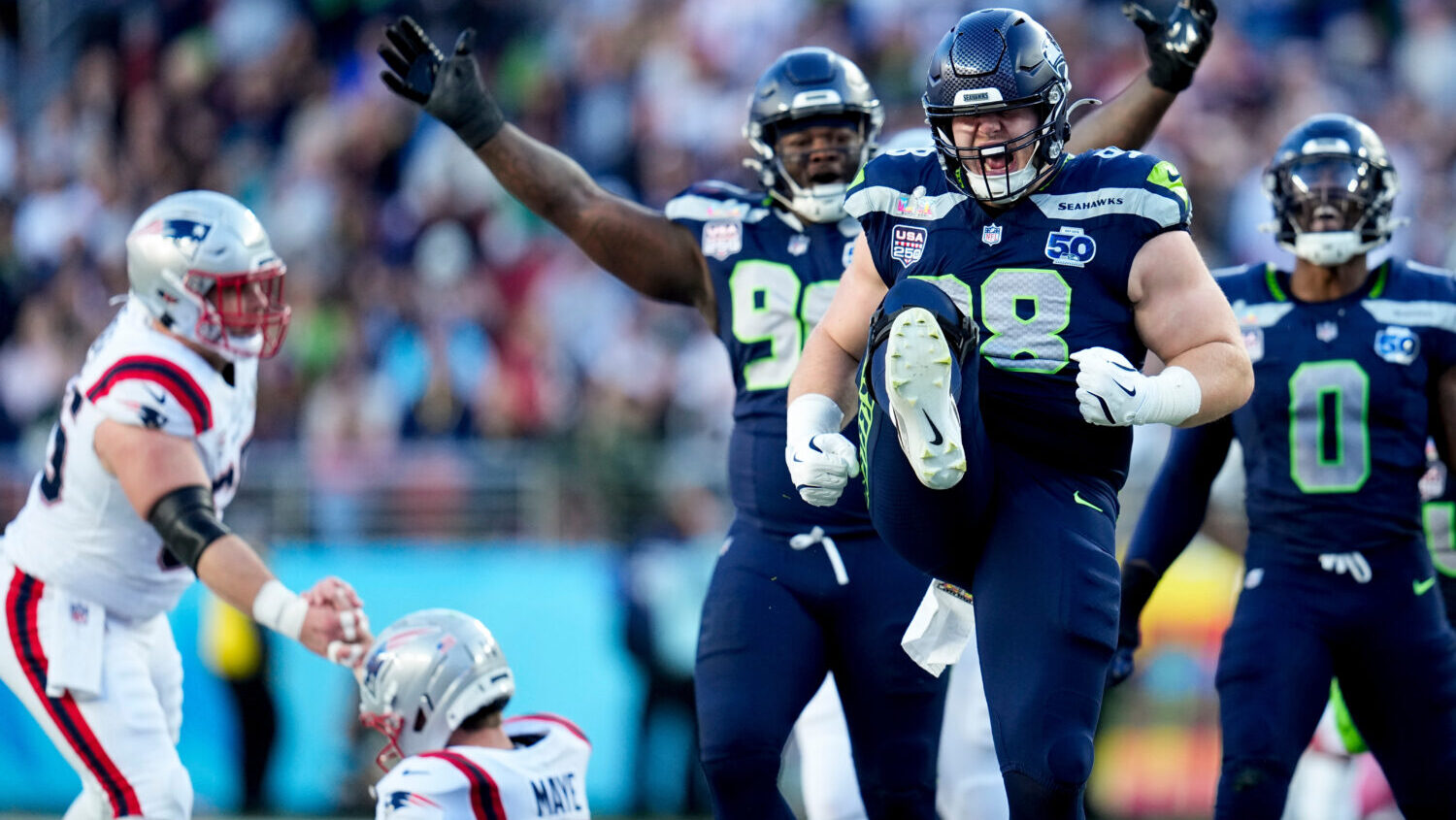 Seattle Seahawks defensive end Rylie Mills (98) celebrates after sacking New England Patriots quart...