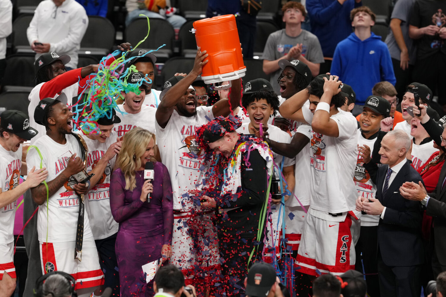 KANSAS CITY, MISSOURI - MARCH 14: The Arizona Wildcats celebrate after winning the Big 12 Tournamen...