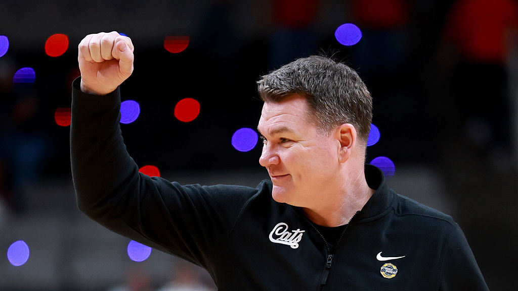 Arizona Wildcats coach Tommy Lloyd celebrates after punching a ticket to an Elite Eight matchup aga...