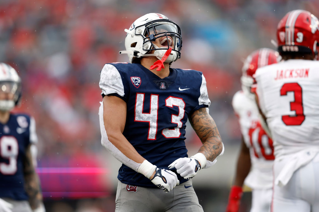 TUCSON, ARIZONA - NOVEMBER 18: Safety Dalton Johnson #43 of the Arizona Wildcats reacts after a def...