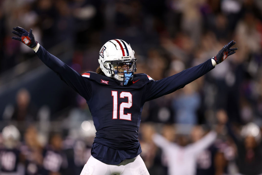 TUCSON, ARIZONA - NOVEMBER 15: Defensive back Genesis Smith #12 of the Arizona Wildcats celebrates ...