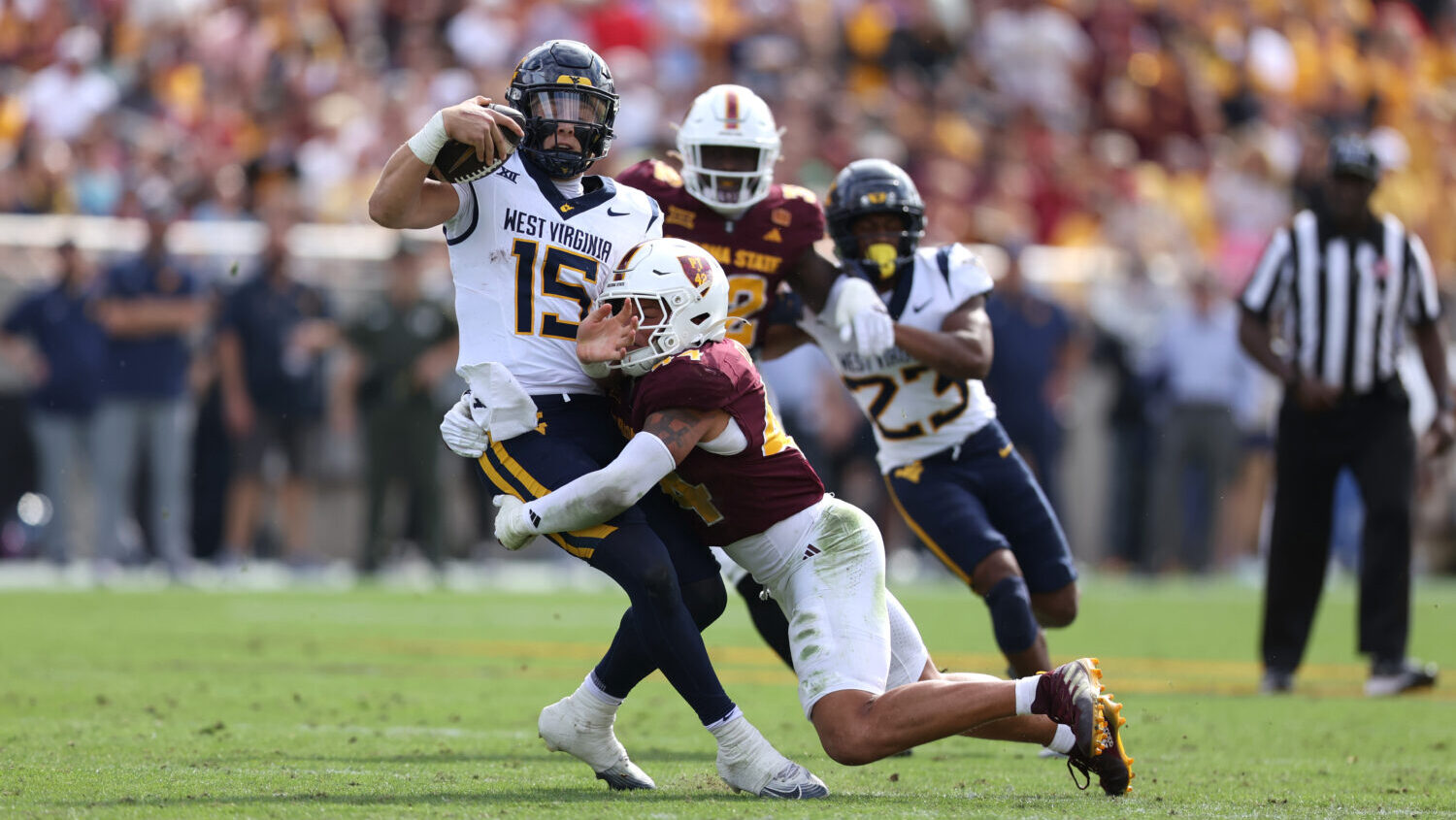 TEMPE, ARIZONA - NOVEMBER 15: Keyshaun Elliott #44 of the Arizona State Sun Devils sacks Scotty Fox...